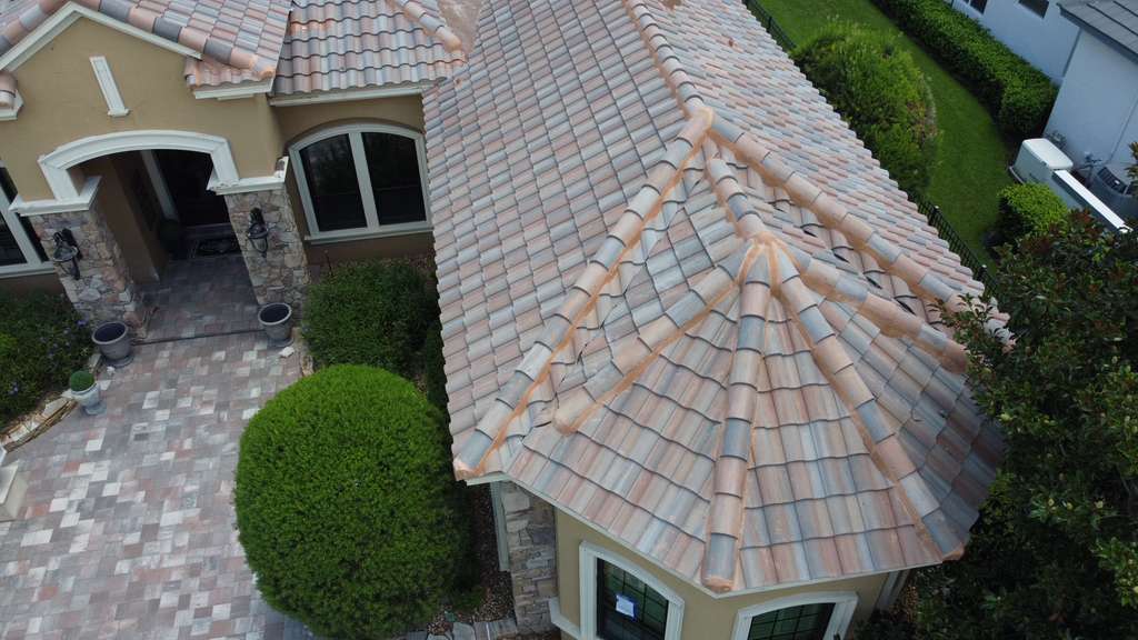 Close-up of a finished blended clay tile roof with hip and ridge detail